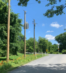 Dominion Energy power poles at the north entrance of the Waterford Virginia National Historic Landmark